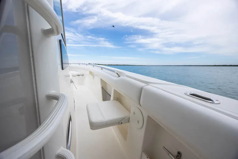 Slide: The Image of 2017 Boston Whaler 370 Outrage boat deck with ocean view and clear sky. - 34