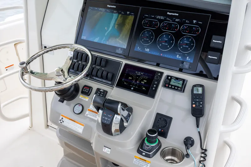 Slide: The Image of Control panel of a 2017 Boston Whaler 370 Outrage with advanced navigation systems. - 30