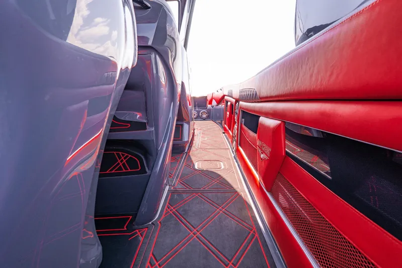 Slide: The Image of Interior of 2022 Deep Impact 399 Sport boat with red and black accents. - 41