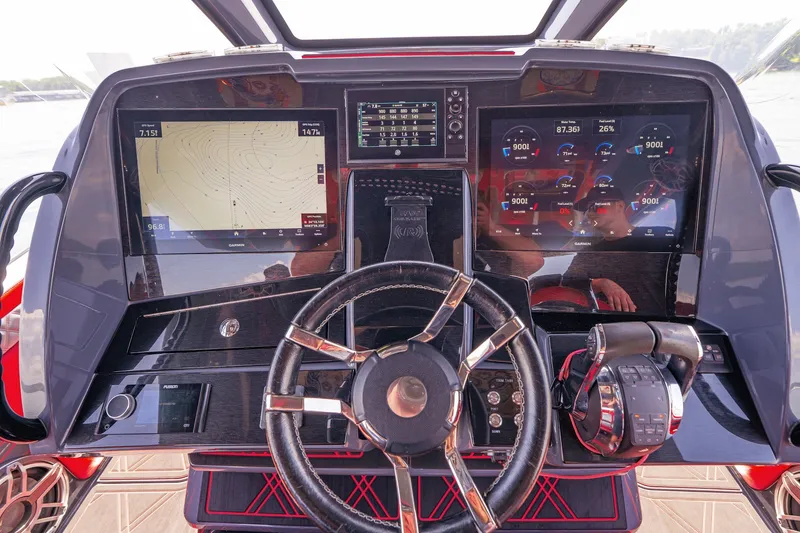Slide: The Image of Dashboard of 2022 Deep Impact 399 Sport boat with navigation and control systems. - 45