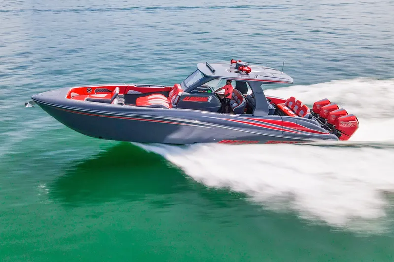 Slide: The Image of 2022 Deep Impact 399 Sport boat speeding on open water, featuring sleek design and vibrant colors. - 92