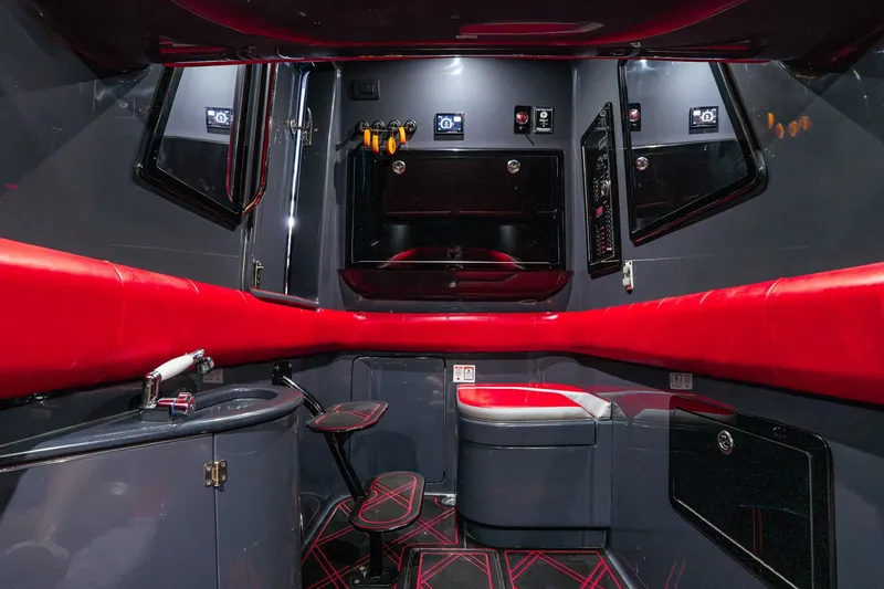 Slide: The Image of Luxurious interior of 2022 Deep Impact 399 Sport boat with red and black accents. - 86
