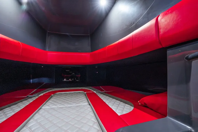 Slide: The Image of Interior cabin of 2022 Deep Impact 399 Sport boat with red and gray seating. - 84