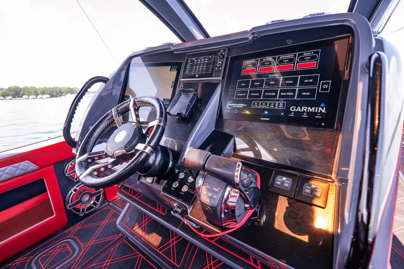 Slide: The Image of Cockpit of 2022 Deep Impact 399 Sport boat with advanced Garmin navigation system. - 49