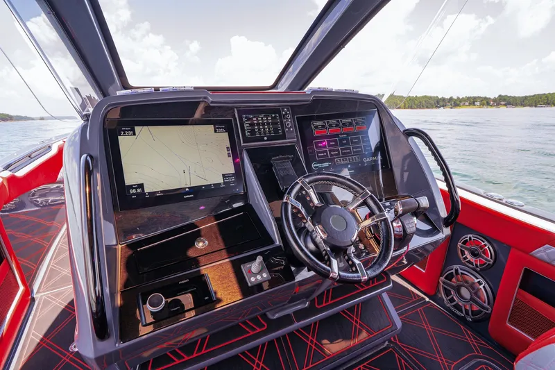 Slide: The Image of Cockpit of 2022 Deep Impact 399 Sport boat with advanced navigation system and sleek design. - 46