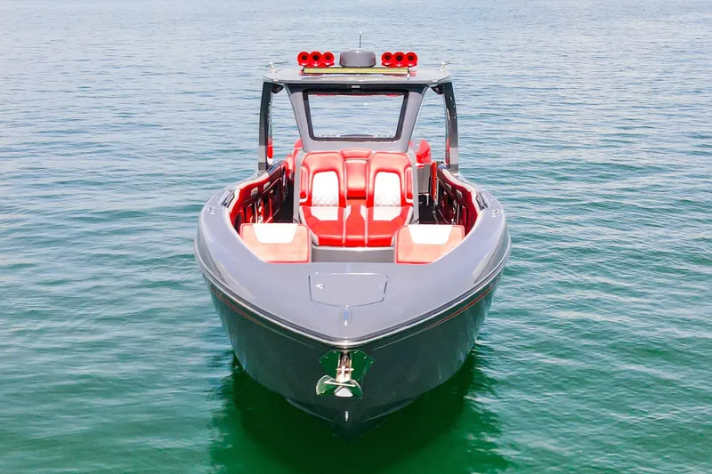 Slide: The Image of 2022 Deep Impact 399 Sport boat with red seating on calm water. - 16