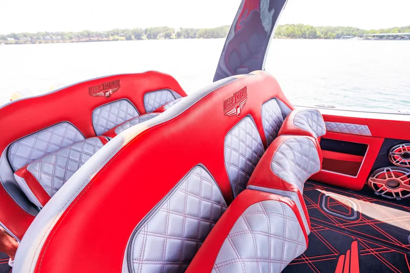 Slide: The Image of Red and gray interior of 2022 Deep Impact 399 Sport boat with quilted seats. - 61