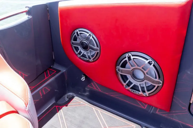 Slide: The Image of Red interior of 2022 Deep Impact 399 Sport boat with dual speakers. - 79