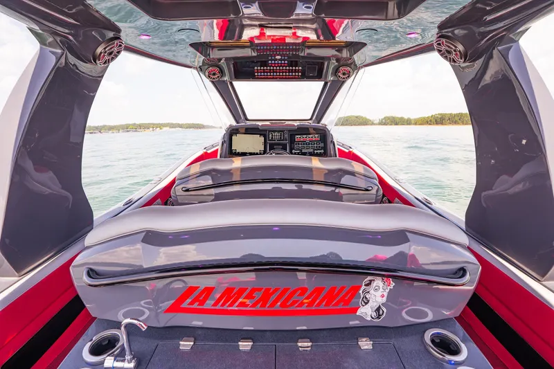 Slide: The Image of 2022 Deep Impact 399 Sport boat interior with "La Mexicana" design on the water. - 65