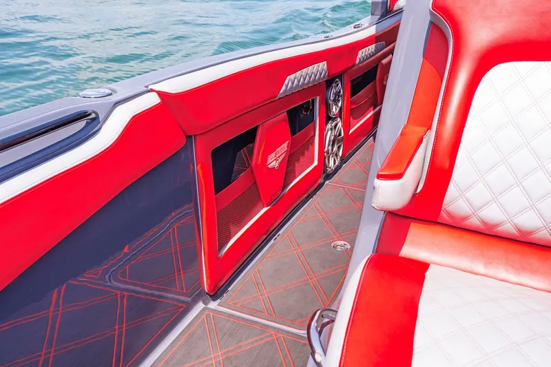 Slide: The Image of Interior of 2022 Deep Impact 399 Sport boat with red and white seating. - 42