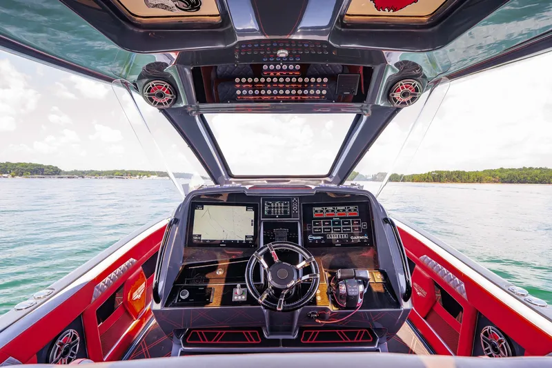 Slide: The Image of Cockpit view of 2022 Deep Impact 399 Sport boat with advanced navigation system. - 44