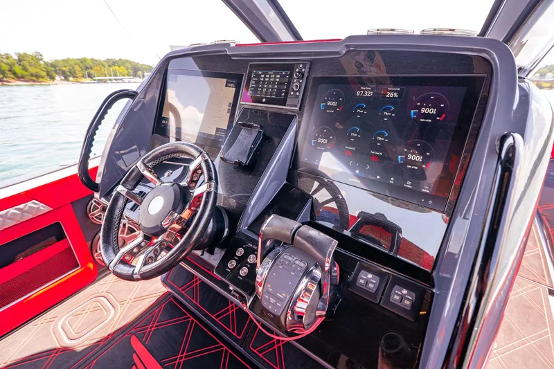 Slide: The Image of Cockpit of 2022 Deep Impact 399 Sport boat with advanced navigation displays. - 47