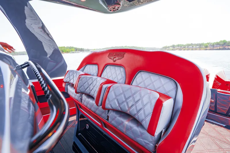 Slide: The Image of Luxurious red and gray seating on 2022 Deep Impact 399 Sport boat. - 62