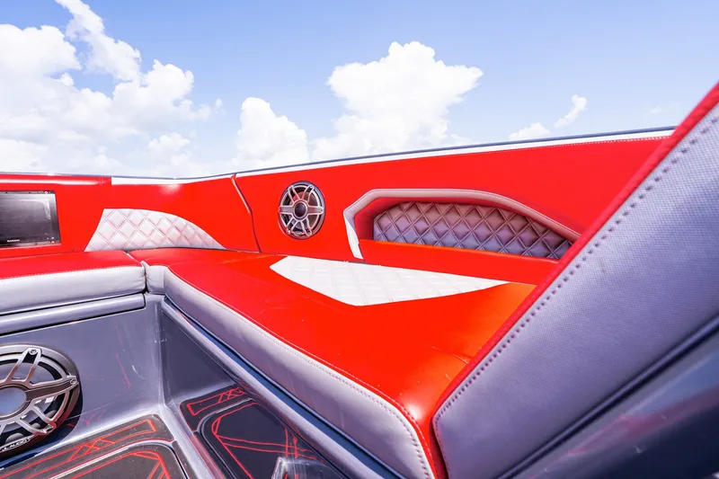 Slide: The Image of Red and white interior of 2022 Deep Impact 399 Sport boat under blue sky. - 37