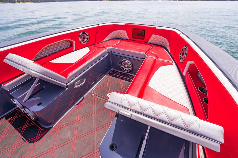 Slide: The Image of Luxurious red and white seating on 2022 Deep Impact 399 Sport boat interior. - 32