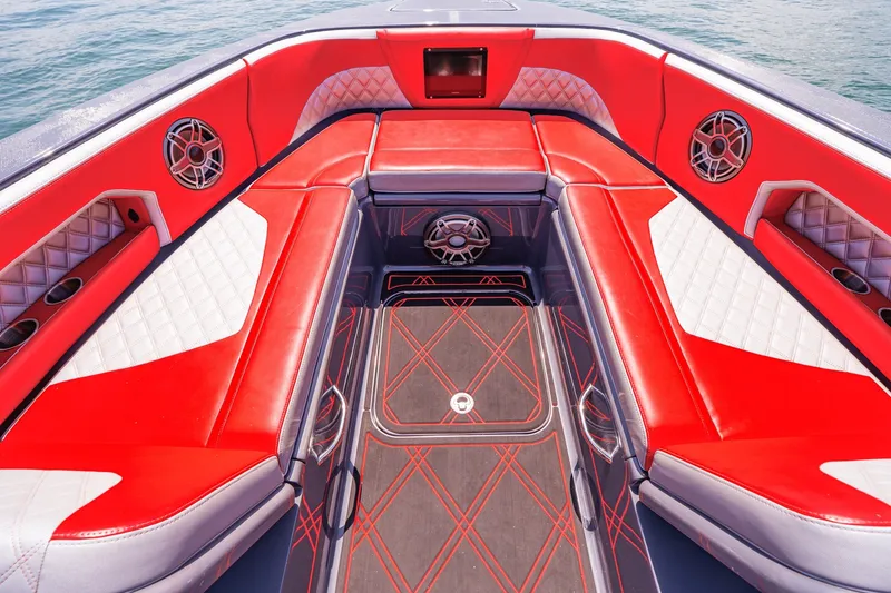 Slide: The Image of Luxurious red and white seating on 2022 Deep Impact 399 Sport boat interior. - 31