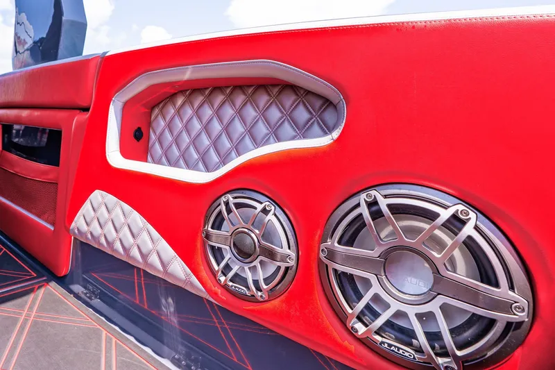 Slide: The Image of Red and white interior of 2022 Deep Impact 399 Sport boat with JL Audio speakers. - 78