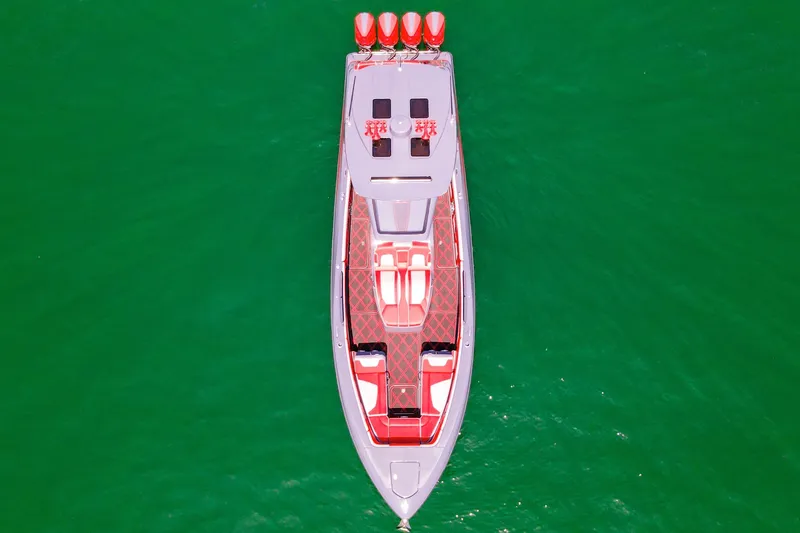 Slide: The Image of Aerial view of 2022 Deep Impact 399 Sport boat on vibrant green water. - 23
