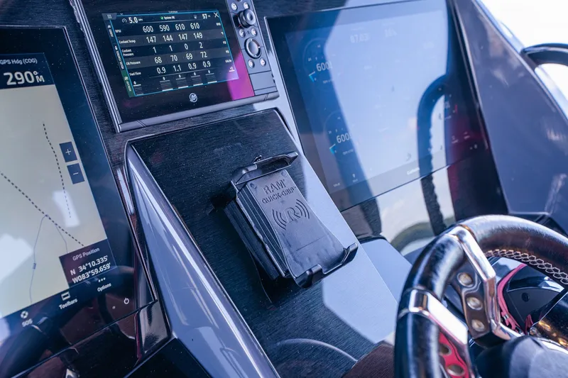 Slide: The Image of Dashboard of 2022 Deep Impact 399 Sport boat with navigation and control screens. - 57