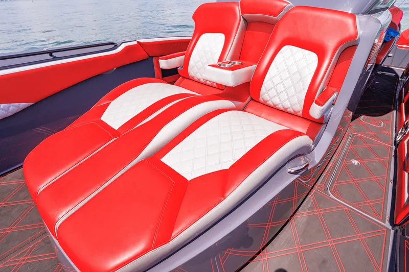 Slide: The Image of Luxurious red and white seating on 2022 Deep Impact 399 Sport boat. - 35
