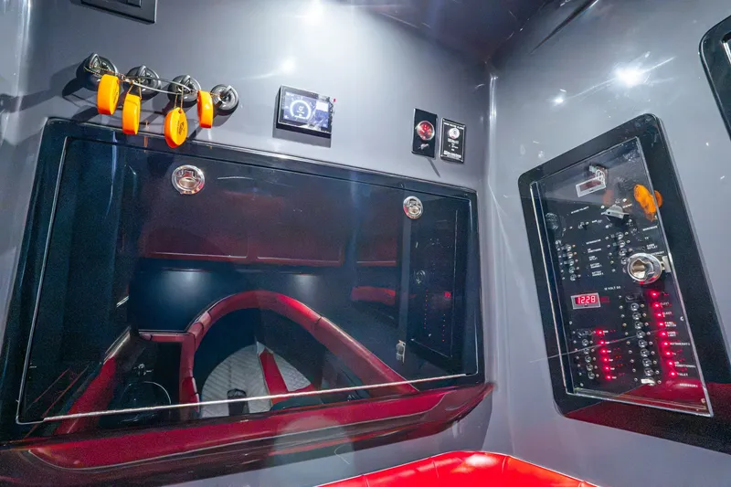 Slide: The Image of Interior of 2022 Deep Impact 399 Sport boat with control panels and seating. - 89
