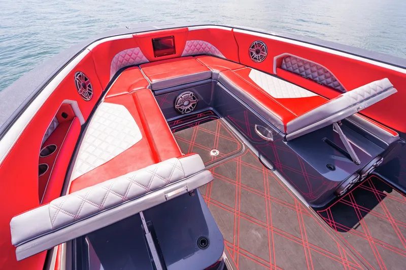 Slide: The Image of Luxurious red and white seating on 2022 Deep Impact 399 Sport boat interior. - 28