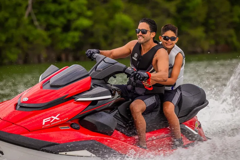 Slide: The Image of Manufacturer Provided Image: Father and son enjoying a ride on a 2026 Yamaha WaveRunner FX Cruiser HO. - 5