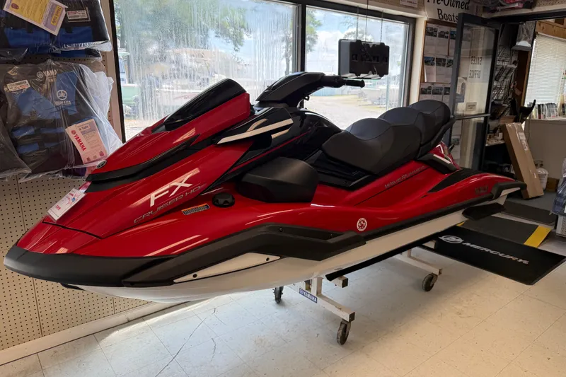Slide: The Image of 2026 Yamaha WaveRunner FX Cruiser HO in showroom, vibrant red color, side view. - 1