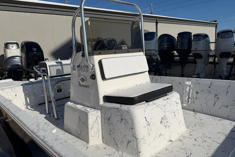 Slide: The Image of 2026 Skuta 21 Tournament V boat with marbled deck and seating, displayed outdoors. - 35
