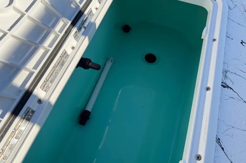 Slide: The Image of Open storage compartment in Skuta 21 Tournament V boat, 2026 model. - 51