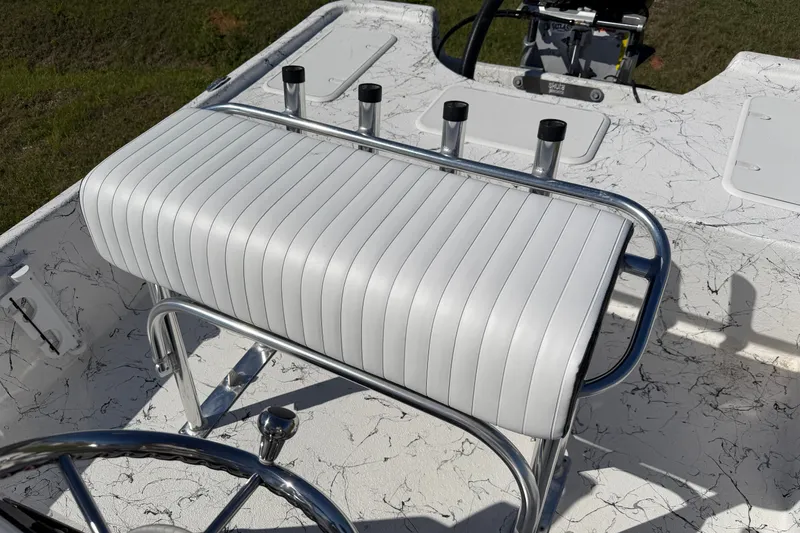 Slide: The Image of White cushioned seat on Skuta 21 Tournament V boat, 2026 model, with rod holders. - 18