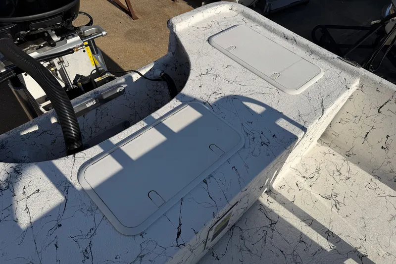 Slide: The Image of Deck view of 2026 Skuta 21 Tournament V boat with storage compartments. - 53