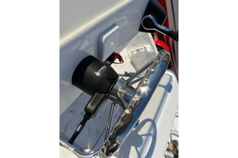 Slide: The Image of Steering wheel and controls of 2026 Skuta 21 Tournament V boat. - 64