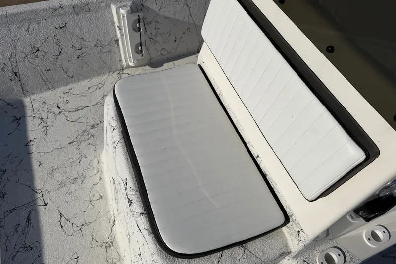 Slide: The Image of White seating area on 2026 Skuta 21 Tournament V boat interior. - 45