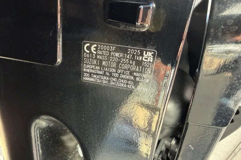 Slide: The Image of Label on Suzuki motor, displaying specifications and manufacturing details. - 25