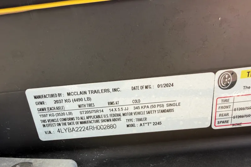 Slide: The Image of Label on McClain trailer showing specifications and manufacturing details, dated January 2024. - 32
