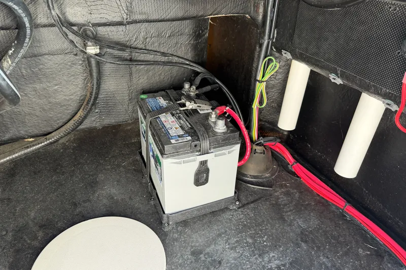 Slide: The Image of Battery setup in a 2026 Skuta 21 Tournament V boat, featuring wiring and components. - 40