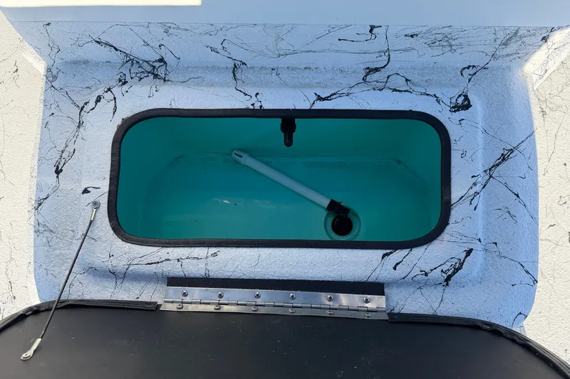 Slide: The Image of Livewell compartment of 2026 Skuta 21 Tournament V boat with marble-patterned interior. - 44