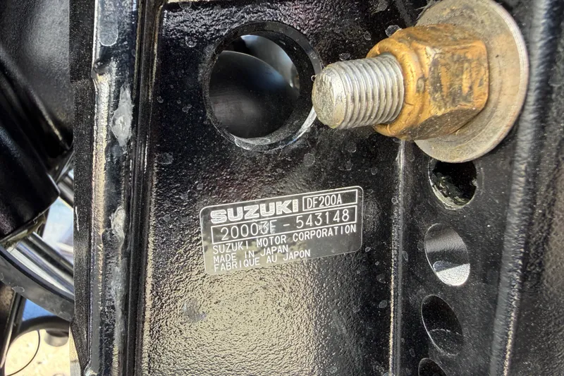 Slide: The Image of Close-up of Suzuki DF200A engine plate on Skuta 21 Tournament V, 2026 model. - 26