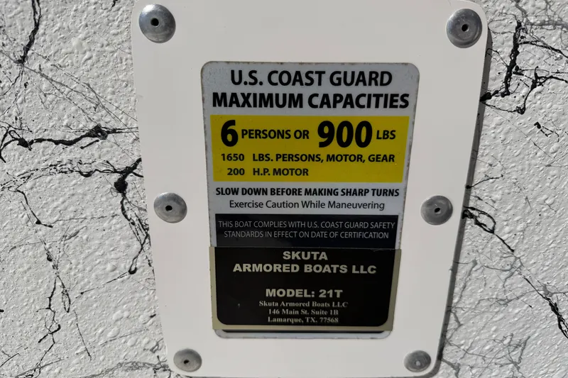 Slide: The Image of Capacity label on Skuta 21 Tournament V boat, 2026 model, detailing weight and passenger limits. - 20