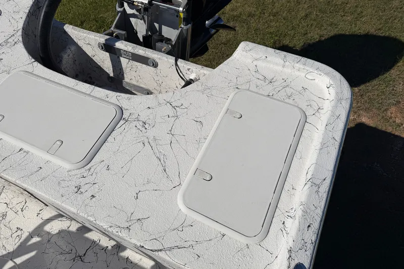 Slide: The Image of 2026 Skuta 21 Tournament V boat deck with storage compartments, marble pattern design. - 19