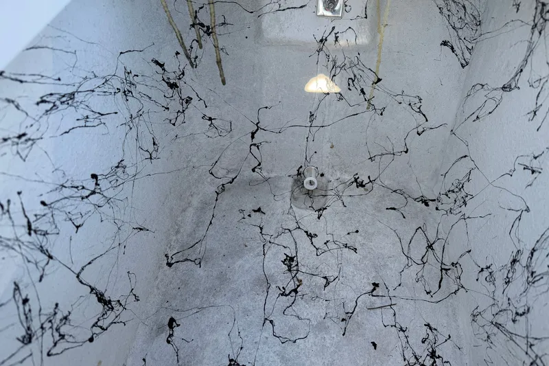 Slide: The Image of Interior of a 2026 Skuta 21 Tournament V boat with intricate black line patterns. - 55