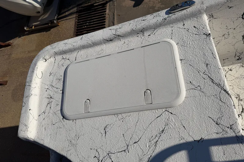 Slide: The Image of Textured deck of 2026 Skuta 21 Tournament V boat with storage hatch. - 49