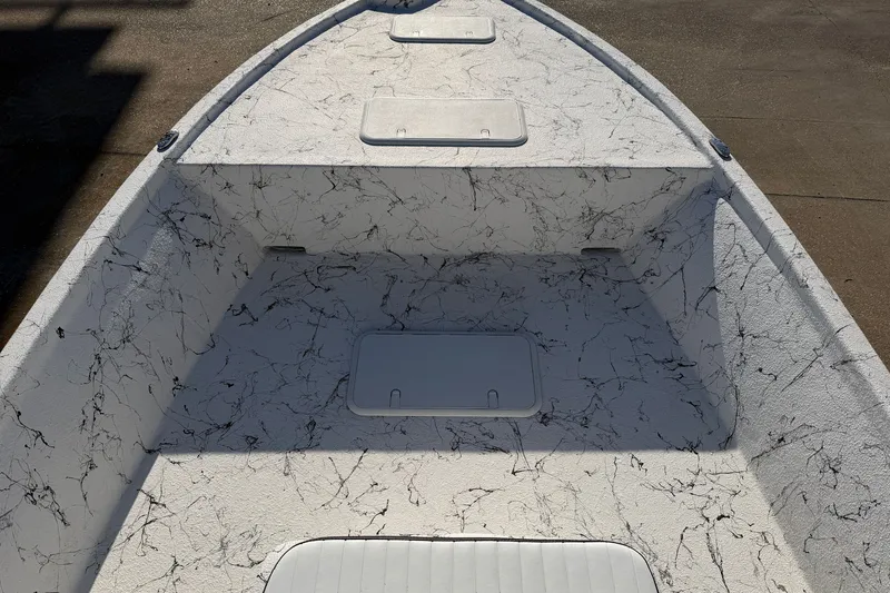 Slide: The Image of Interior view of 2026 Skuta 21 Tournament V boat with textured white finish. - 42