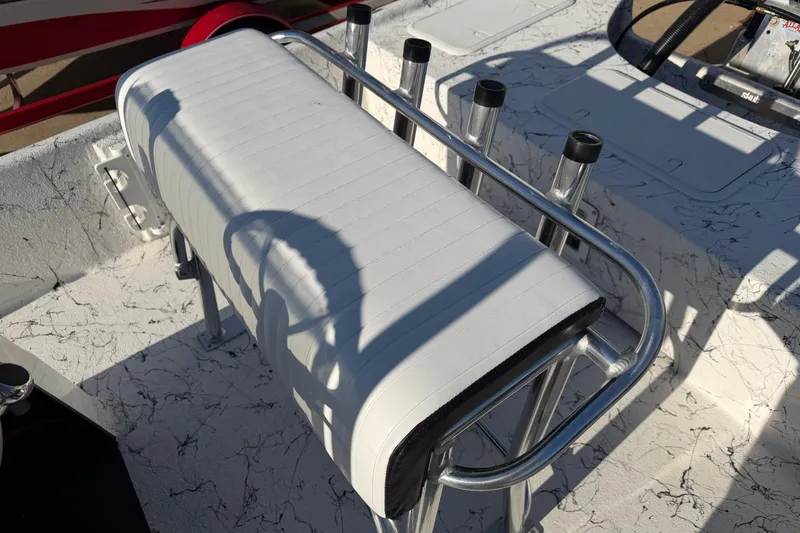 Slide: The Image of White cushioned seat on 2026 Skuta 21 Tournament V boat with rod holders. - 60