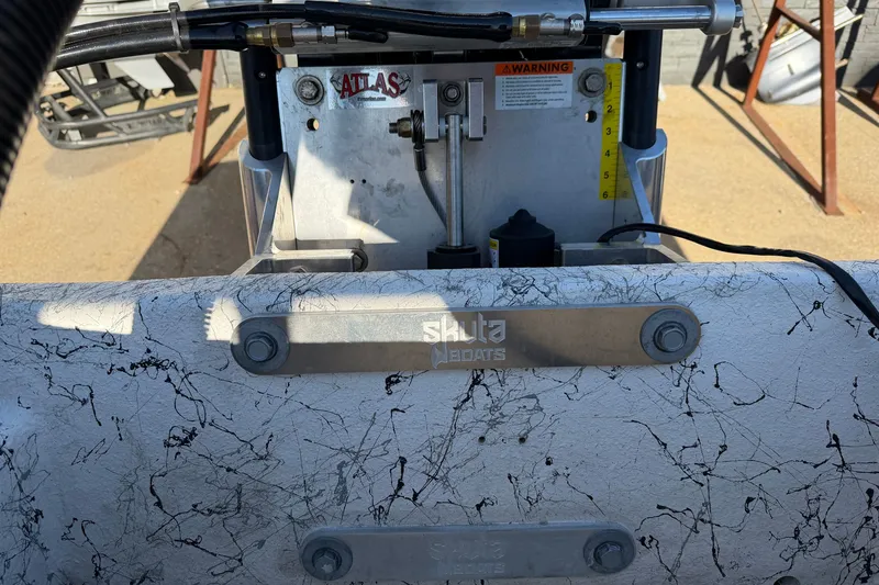 Slide: The Image of Close-up of Skuta 21 Tournament V boat components, featuring hydraulic system and textured surface, 2026 model. - 57