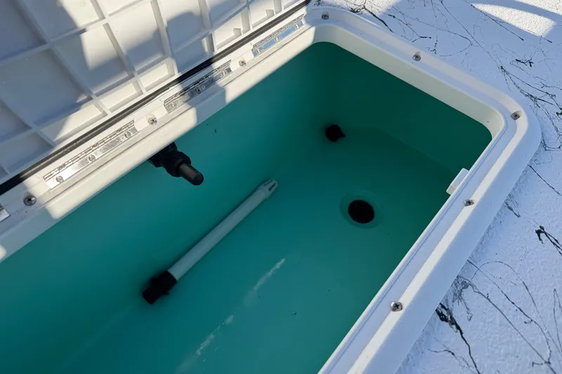 Slide: The Image of Open storage compartment in Skuta 21 Tournament V boat, 2026 model. - 52