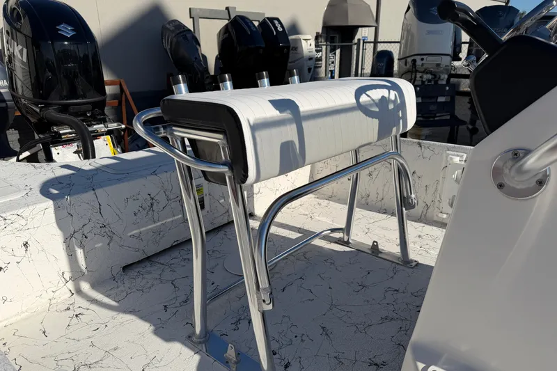 Slide: The Image of 2026 Skuta 21 Tournament V boat interior with sleek seating and multiple outboard motors. - 36