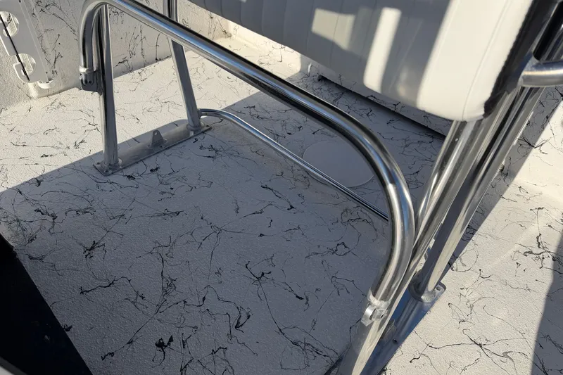 Slide: The Image of Stainless steel railing on Skuta 21 Tournament V boat, 2026 model, with textured flooring. - 61