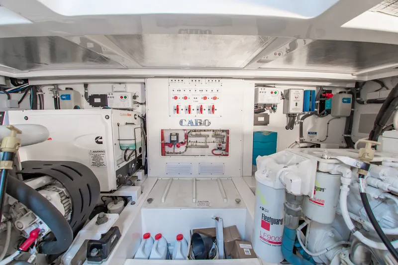 Slide: The Image of Engine room of 2013 Cabo 40 Hardtop Express, showcasing mechanical systems and components. - 34